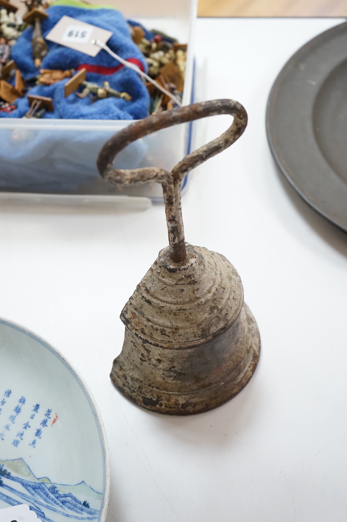 A 19th century cast iron bell shaped door stop, 29cm high